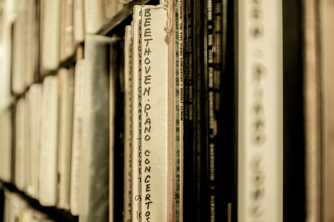 Rows of archived public record folders on shelves