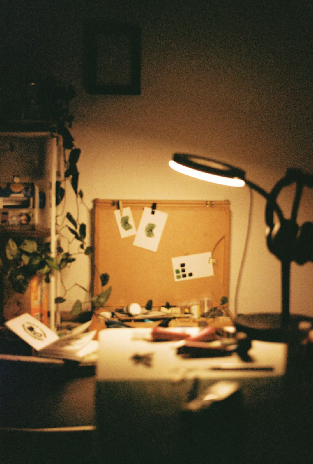 Stack of official documents and a magnifying glass on a desk